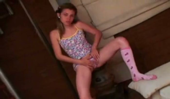 Young girl masturbates her tight pussy